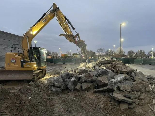 Excavator working through concrete demolition at a Hyperion jobsite